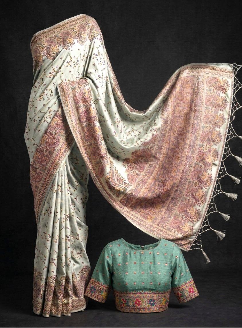  Sashikala Tradimatching blouse tional saree with a on a black background