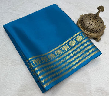 royal blue crepe silk saree with Gold Zari Elephant Border