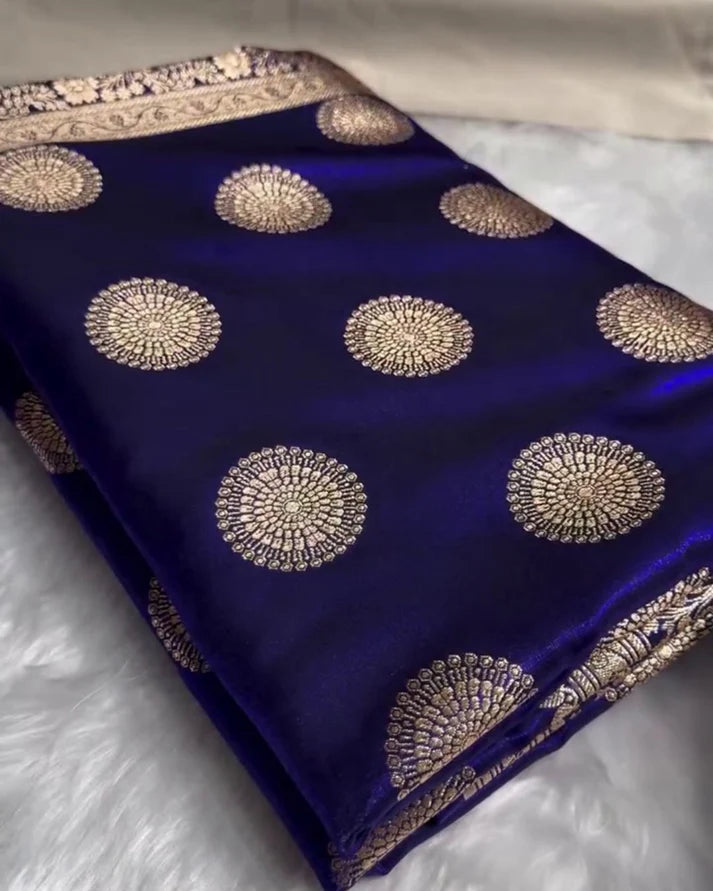 Blue fabric with gold embroidery on a white surface